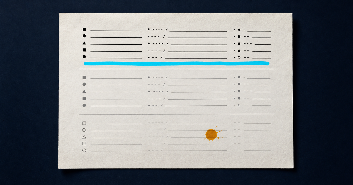 A single sheet of off-white paper photographed straight down with three grouped field blocks, the first printed crisply, the second grey, the third only faint pencil ruling with an amber ink blot